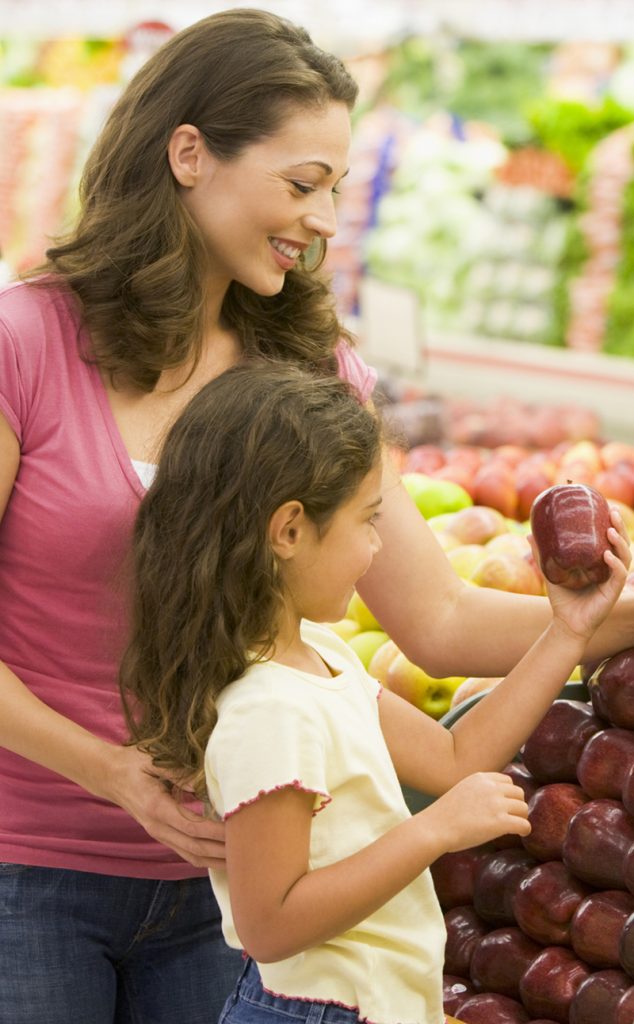 Mother and daughter shopping for fresh produce